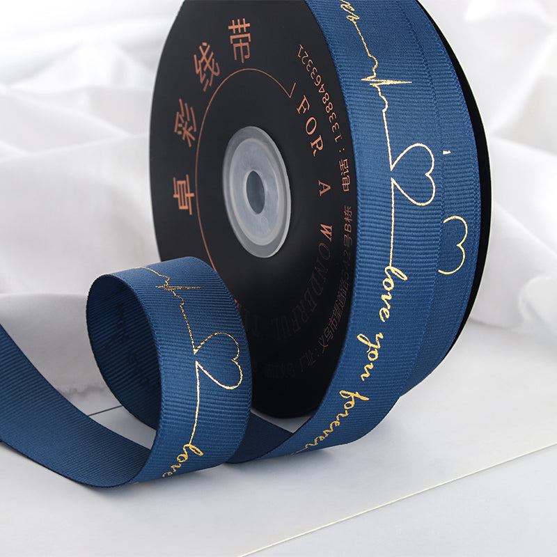 Ruban de battement de cœur estampé doré pour emballage de gâteau, pâtisserie, fleur, cadeau (2,5 cm x 45 mètres)