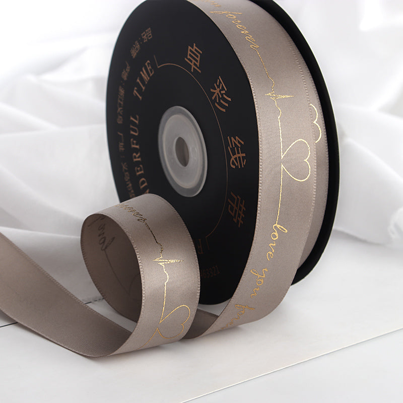 Ruban de battement de cœur estampé doré pour emballage de gâteau, pâtisserie, fleur, cadeau (2,5 cm x 45 mètres)