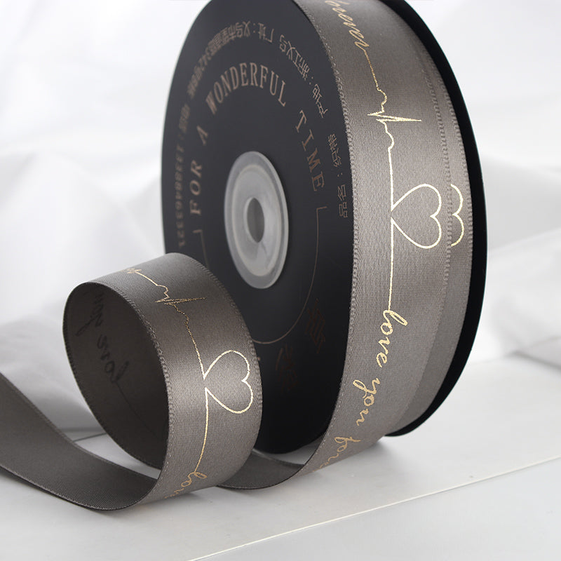Ruban de battement de cœur estampé doré pour emballage de gâteau, pâtisserie, fleur, cadeau (2,5 cm x 45 mètres)
