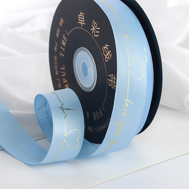 Ruban de battement de cœur estampé doré pour emballage de gâteau, pâtisserie, fleur, cadeau (2,5 cm x 45 mètres)