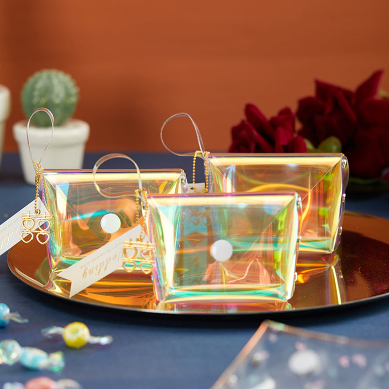 حقيبة هدايا شفافة عاكسة ملونة مقاومة للماء مصنوعة من مادة البولي فينيل كلوريد بالليزر وحقيبة سكر للزفاف