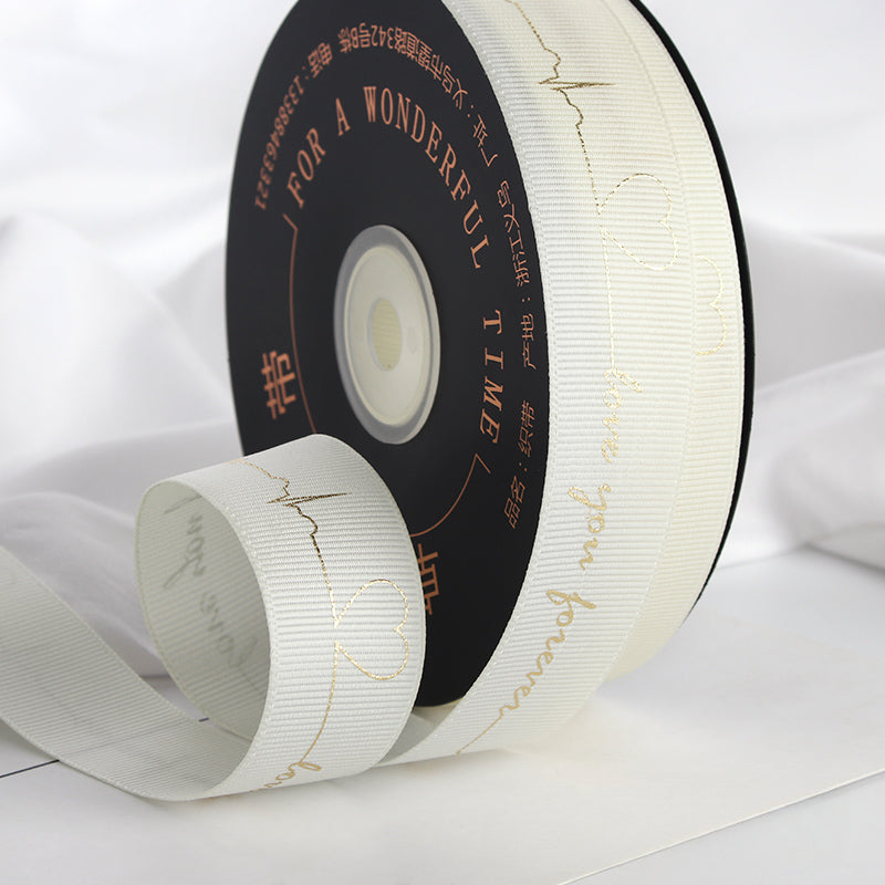 Ruban de battement de cœur estampé doré pour emballage de gâteau, pâtisserie, fleur, cadeau (2,5 cm x 45 mètres)