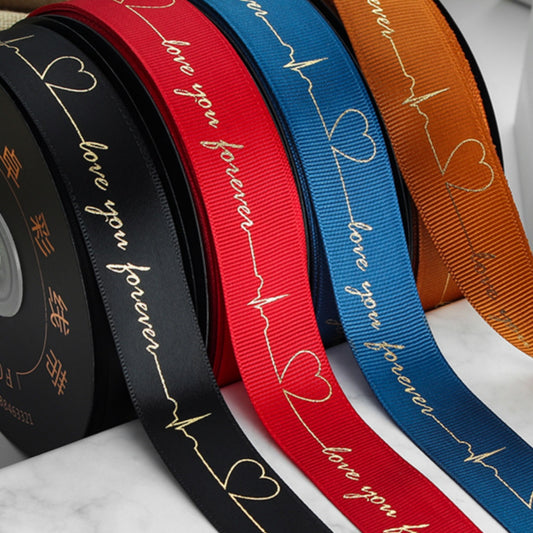 Ruban de battement de cœur estampé doré pour emballage de gâteau, pâtisserie, fleur, cadeau (2,5 cm x 45 mètres)