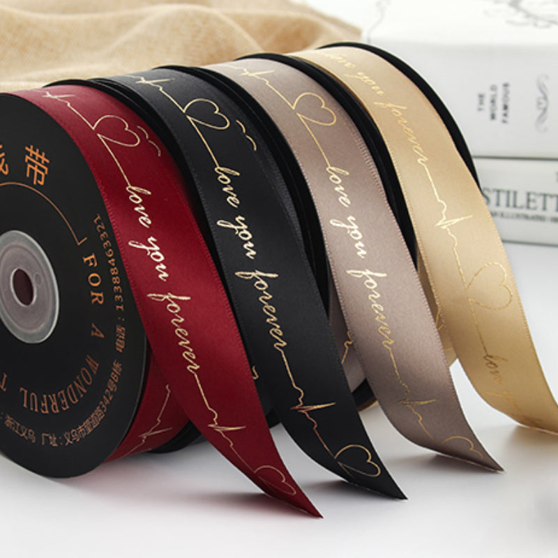 Ruban de battement de cœur estampé doré pour emballage de gâteau, pâtisserie, fleur, cadeau (2,5 cm x 45 mètres)