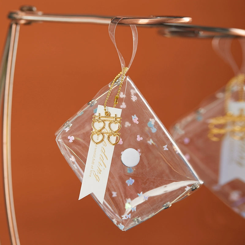 حقيبة هدايا شفافة عاكسة ملونة مقاومة للماء مصنوعة من مادة البولي فينيل كلوريد بالليزر وحقيبة سكر للزفاف