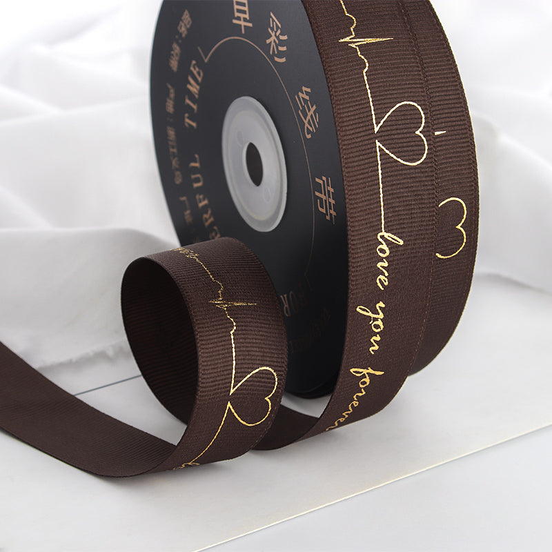Ruban de battement de cœur estampé doré pour emballage de gâteau, pâtisserie, fleur, cadeau (2,5 cm x 45 mètres)
