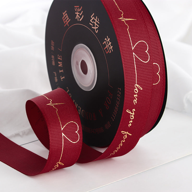 Ruban de battement de cœur estampé doré pour emballage de gâteau, pâtisserie, fleur, cadeau (2,5 cm x 45 mètres)