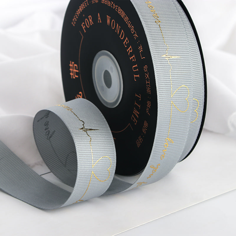 Ruban de battement de cœur estampé doré pour emballage de gâteau, pâtisserie, fleur, cadeau (2,5 cm x 45 mètres)