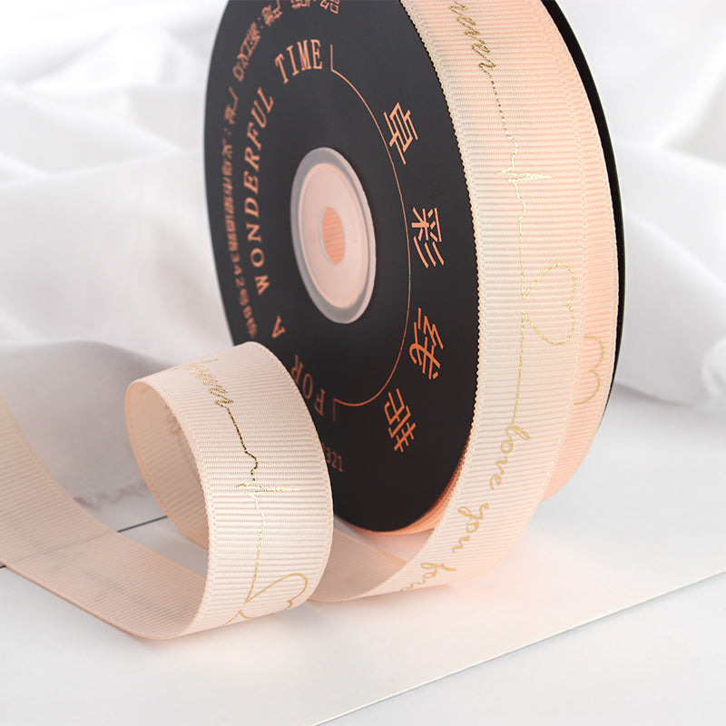 Ruban de battement de cœur estampé doré pour emballage de gâteau, pâtisserie, fleur, cadeau (2,5 cm x 45 mètres)